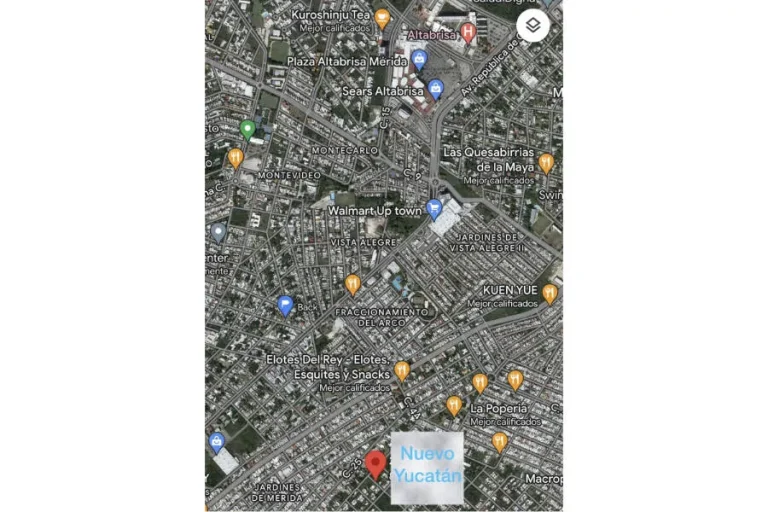 Mapa satelital de una zona de Mérida con un marcador rojo junto al rótulo Nuevo Yucatán y referencias comerciales.